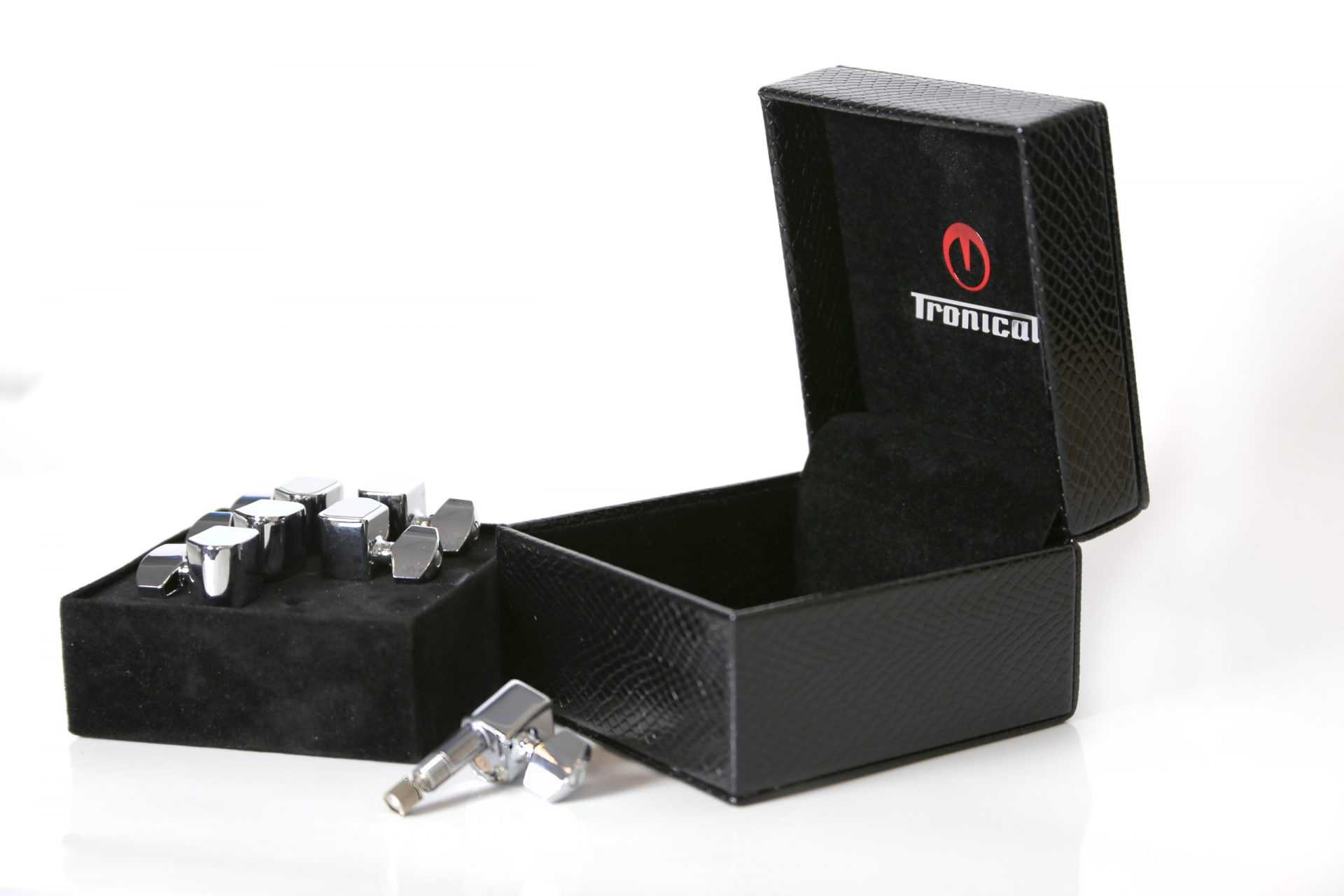 Tronical PowerHead motorized guitar tuning pegs and packaging Chrome PowerHead motorized guitar tuning pegs with an open black presentation box
