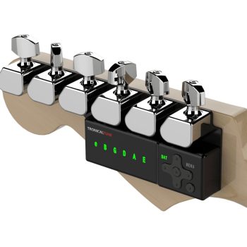 TronicalTune automatic guitar tuner mounted behind a six-in-line guitar headstock with chrome motorized tuning pegs and Strat keys