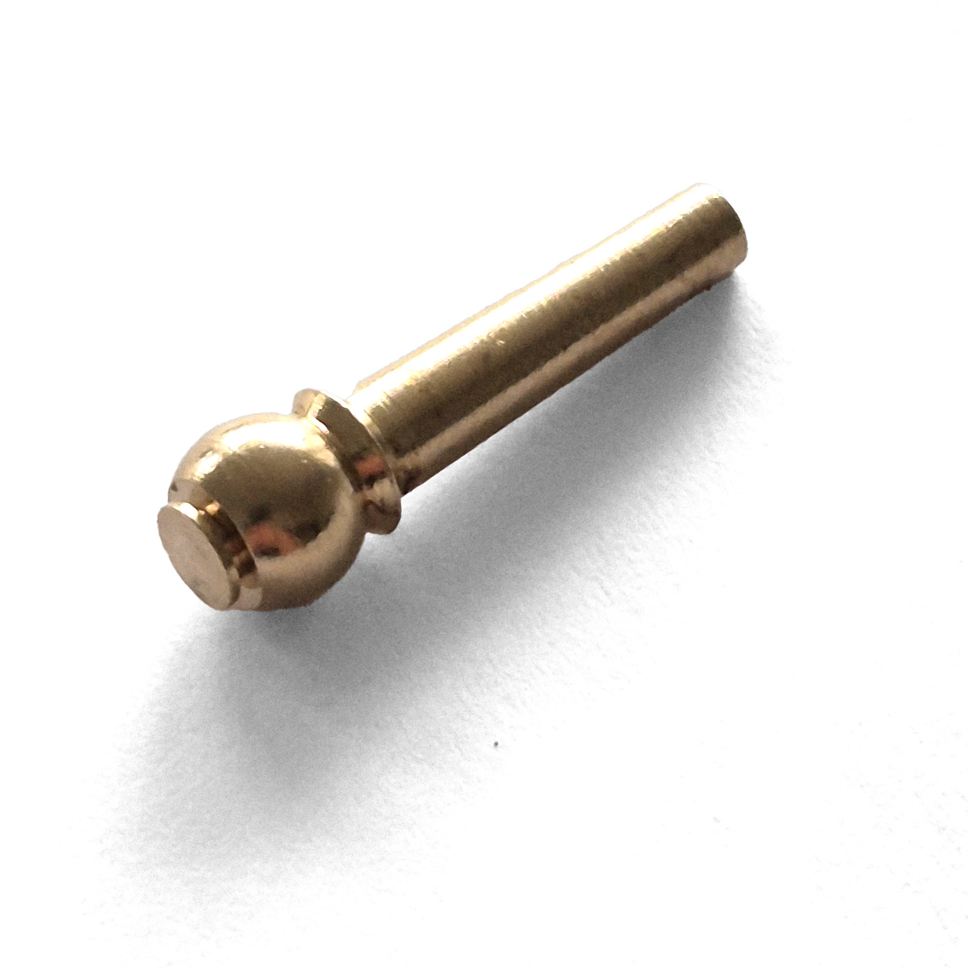Metal acoustic guitar bridge pin - close-up Metal acoustic guitar bridge pin - close-up