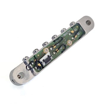 Gibson Robot Gen I active Tune-o-matic bridge - underside Underside of a Gibson Robot Gen I active Tune-o-matic bridge showing the circuit board and wiring