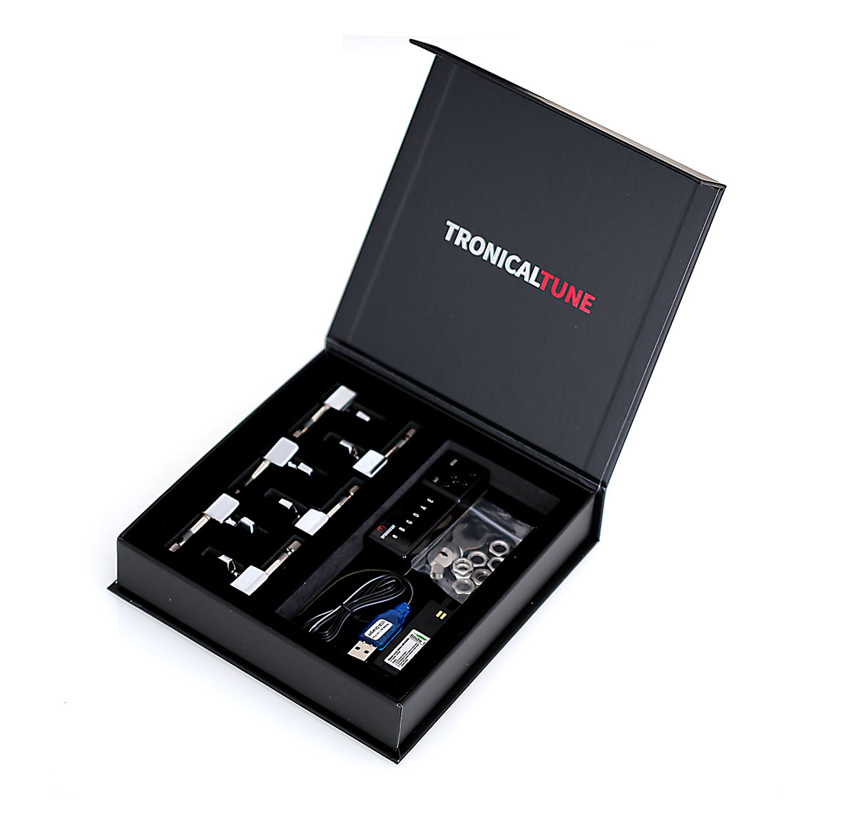 TronicalTune automatic guitar tuner - boxed set Open TronicalTune presentation box containing an automatic guitar tuner set and accessories